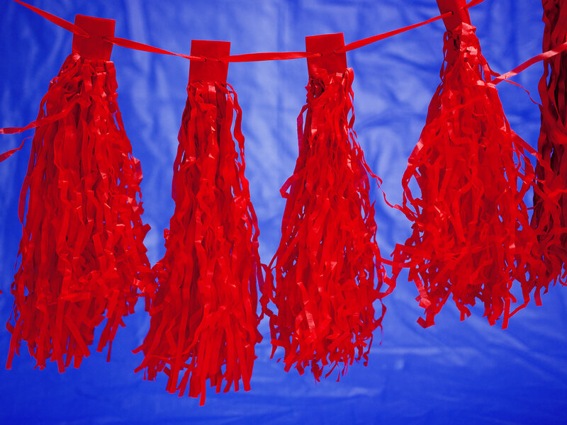 Jonathan Blaustein  Red streamers and blue plastic tablecloth